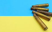 Large caliber bullet casings on the flag of Ukraine