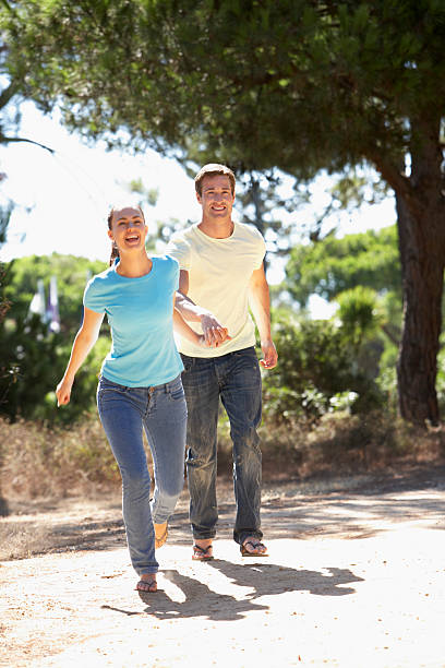 istock Young Couple On Romantic Walk In Countryside 165087714