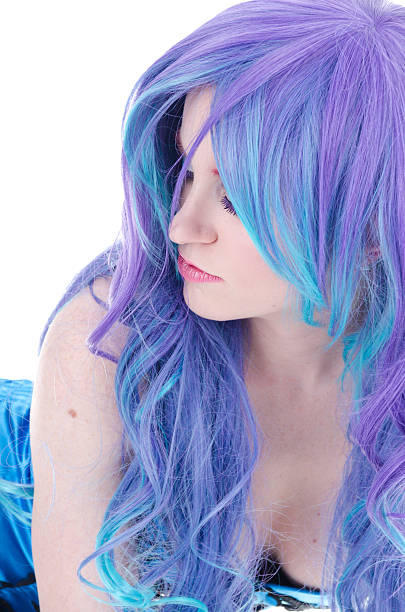 istock Beauty in purple/blue wig leaning forward. 165088615