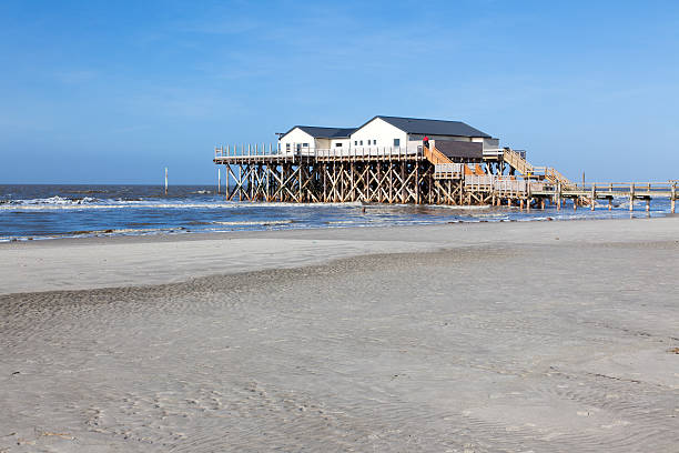 istock Beach with stilt house, Sankt Peter-Ording, Germany 165088678