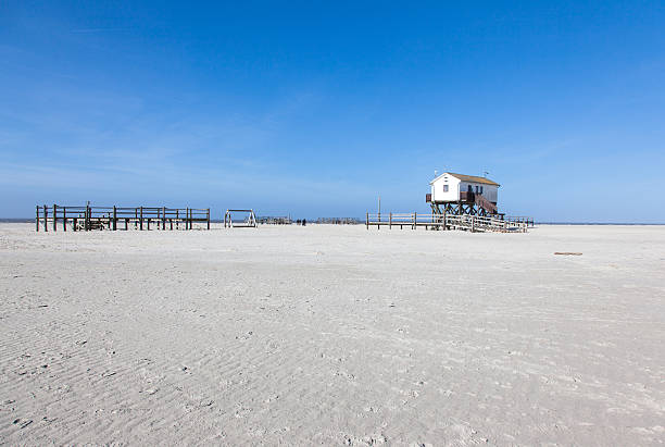 istock Beach with stilt house, Sankt Peter-Ording, Germany 165088679