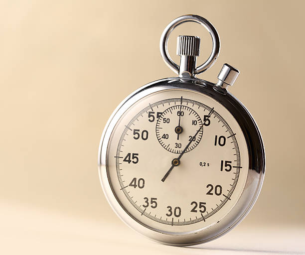 istock Stopwatch closeup on beige background 165089287