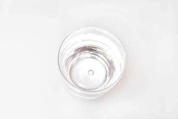 istock Glass filled with water, top shot, isolated on white 165089645