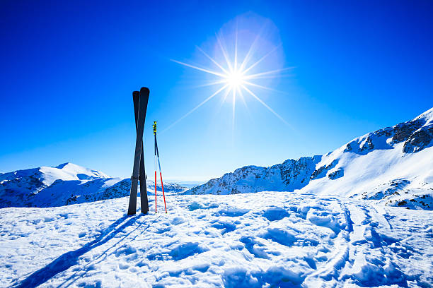 istock Skis on top of slope against sun 165090162
