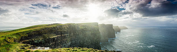 Cliffs of Moher, Ireland, XXXL panorama Cliffs of Moher, County Clare, Ireland, The Burren, Europe are one of Ireland's top touristic attractions. The maximum height of Cliffs is 214 m, lenght 8 km. doolin photos stock pictures, royalty-free photos & images