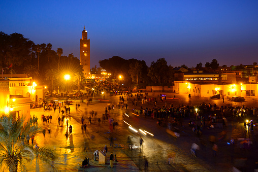 View over Djemaa El Fna square and the Koutoubia mosque at dusk in Marrakech, Morocco.