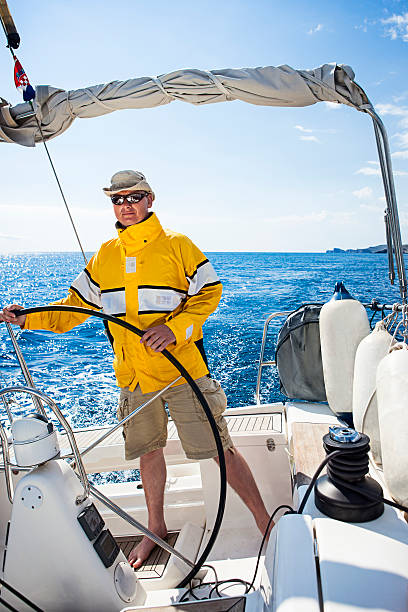 istock Skipper sailing with sailboat 165090646