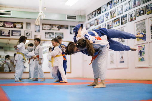 Health, fitness and motivation, men in karate fight for a winner in a dojo. Martial arts, a learning exercise to overcome, fight failure and beat the competition. Sports students in a battle to win.