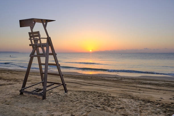 istock Lifeguard surveillance platform on the beach at dawn 1650941213