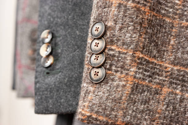 Close up of buttons on a wool jackets. Stylish wool jackets of different colors. Shallow depth of field