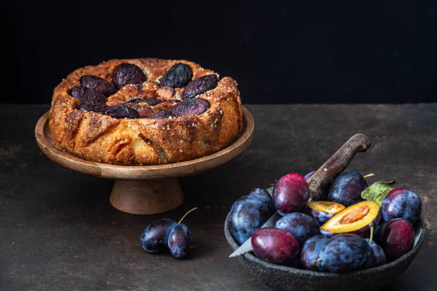 istock Delicious homemade plum cake on a dark background 1650953110
