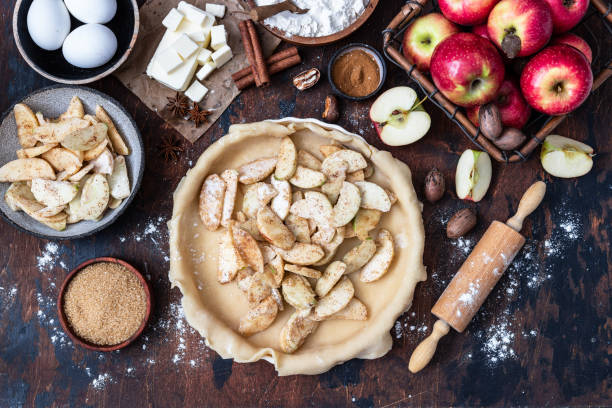 istock Cooking baking concept. Making rustic American style apple pie, top view on table with ingredients 1650953116