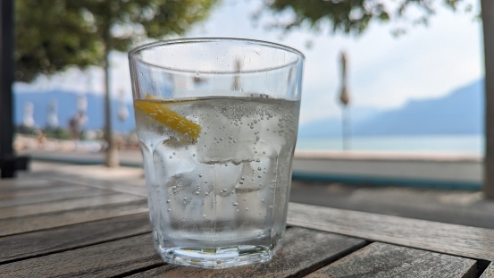 Glass of water on table outdoors