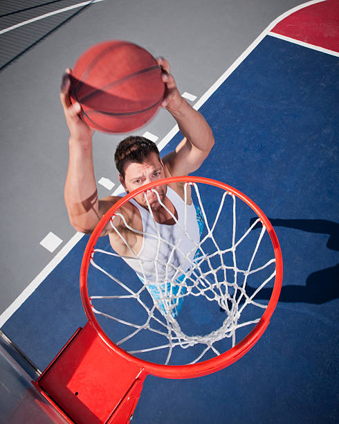 istock Dunk It! Baller In Flight Captured Above the Rim 165097538