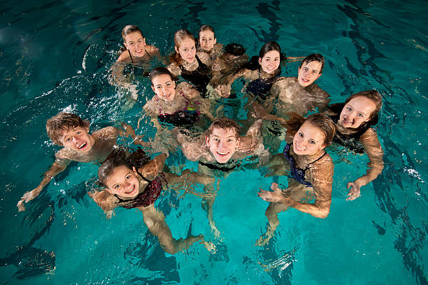 istock Large group of swimmers in pool 165098005