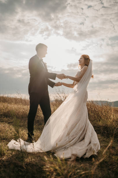 istock Happy newlyweds dancing in nature 1650982712