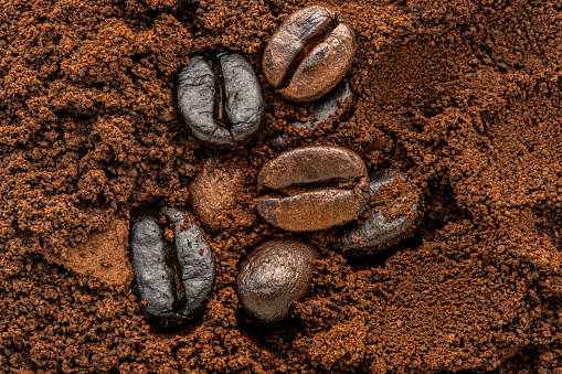 Coffee beans and ground coffee background