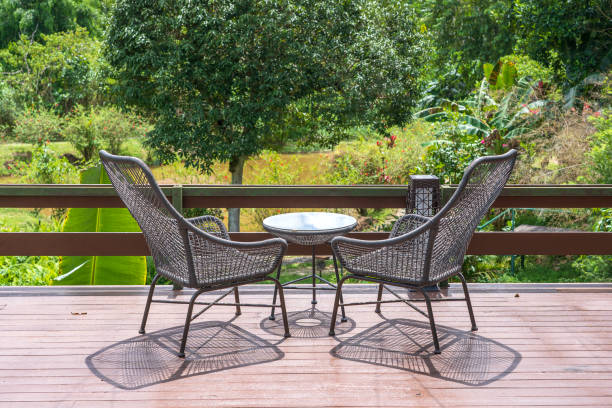 istock Two chairs and table on the backyard in tropical garden with beautiful view 1650992522
