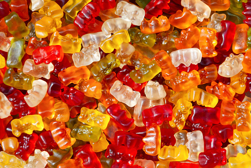 Jelly candies gummy bears of different colors on a white background, colorful fruity marmalade.