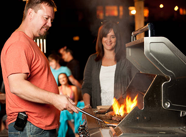 istock A man hosting a BBQ at the end of a summer pool party 165099827