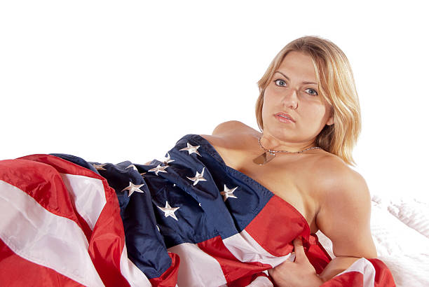 istock young woman implied nude American Flag 165099954