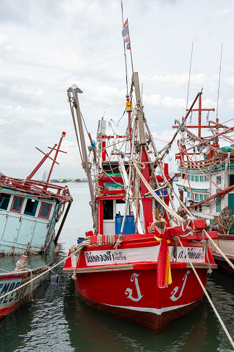 At the fishing pier in the late afternoon the Thai fishing boats from Naklua are lashed to their moorings.\nThe fishermen spend free time on board and live in the cabins of their boats. \nPattaya District Chonburi in Thailand Asia\nAugust 31st 2023