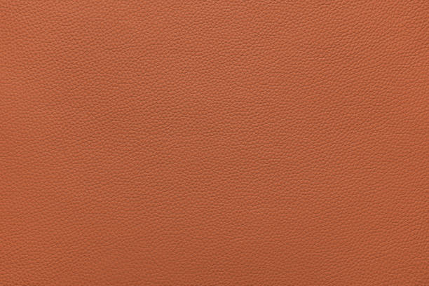 istock Genuine orange leather, eco friendly leatherette texture background 1651005984