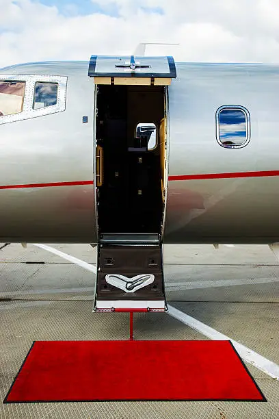 Luxury Business Private Jet plane open door at airfield