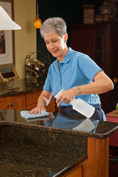 istock Close-up of middle-aged cleaning marble table 165101369