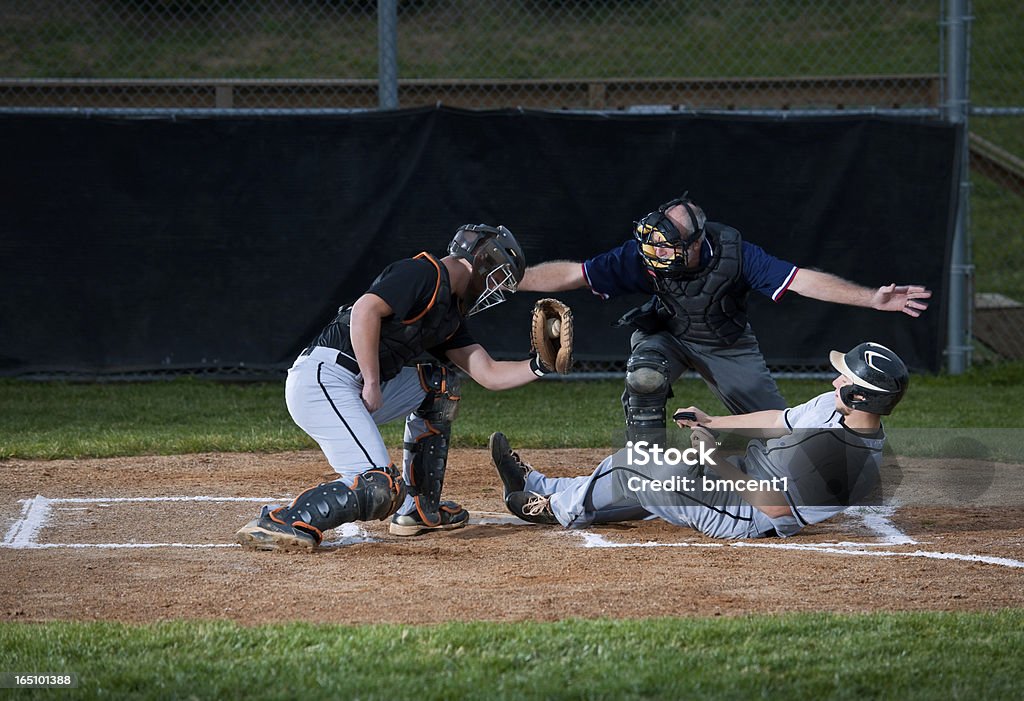 Baseball Player Slides Into Home Plate Baseball - Sport Stock Photo