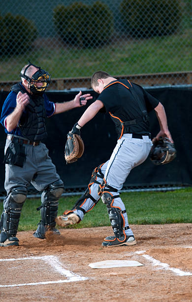 istock Baseball Catcher Kicking Dirt on Umpire During Argument 165101389