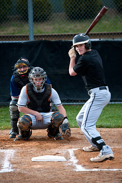 istock Baseball catcher calling the pitch with hand sign 165101403