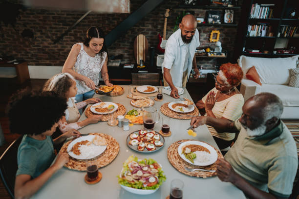 istock family serving themselves for lunch 1651028660