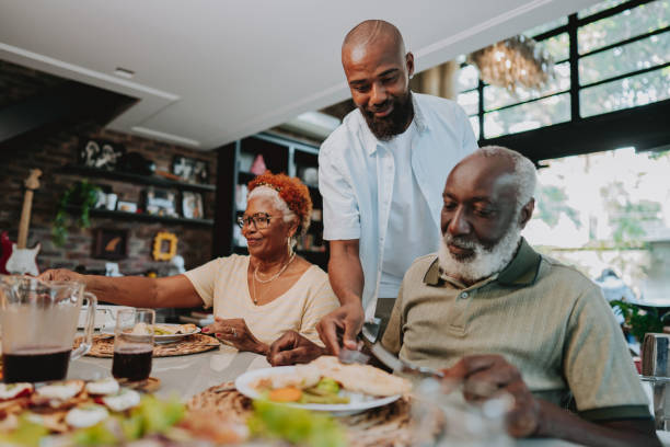 istock family serving themselves for lunch 1651030843