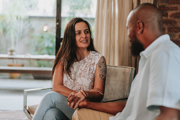 istock Couple talking sitting on the living room sofa 1651034034