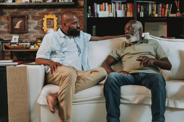 istock Father and son talking on the sofa in the living room 1651034061