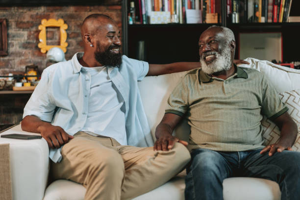 istock Father and son talking on the sofa in the living room 1651035111