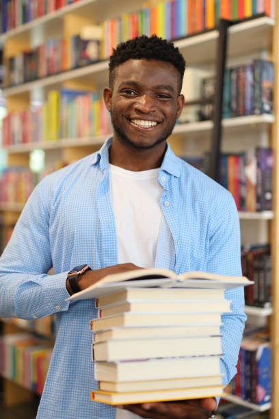 istock A diligent student in a library, absorbed in academic pursuit among bookshelves, eager to learn. 1651037884