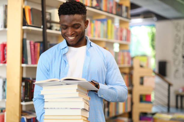 istock A joyful student in a library, surrounded by books, happily engaging in educational exploration. 1651037887