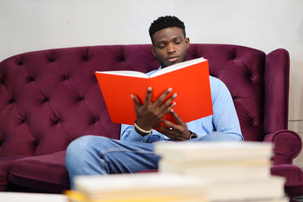 istock A young student engrossed in reading, immersed in education and leisure in a library. 1651038361