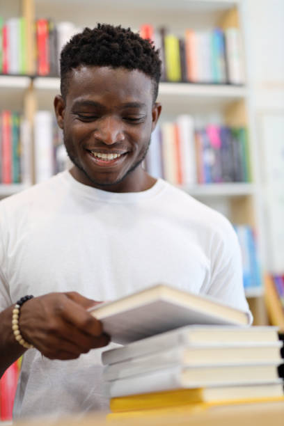 istock A happy young student in a library, studying with a smile among books for educational enrichment. 1651039467