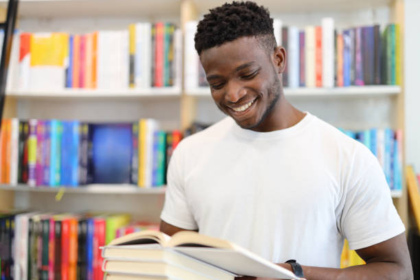 istock A young student in a library, deeply engrossed in learning, wears a joyful smile. 1651039468