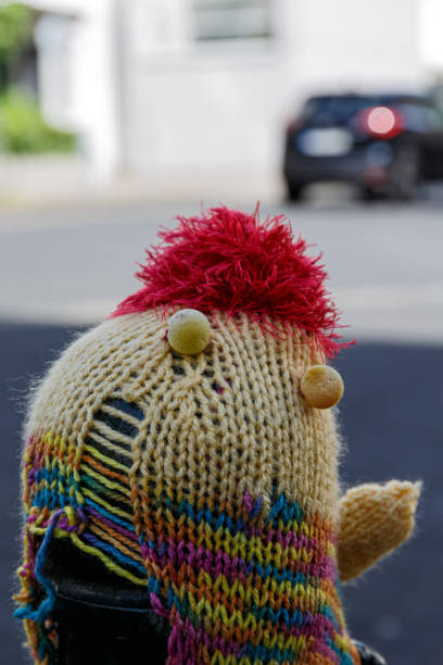 Knitted woolen hats on street posts