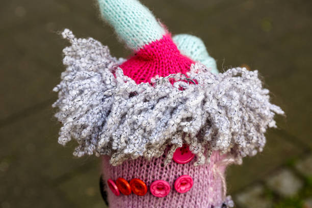 Knitted woolen hats on street posts