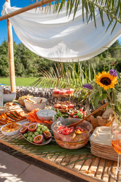 istock Garden party Buffet food on table for celebration in boho style 1651059926
