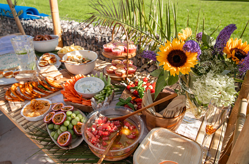 Garden party Buffet food on table for celebration in boho style