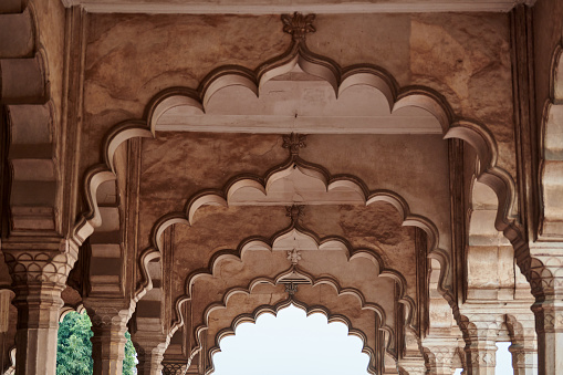 Hall of public audience of Agra red fort in India, beautiful architecture elements with arches of ancient indian building, columns and arches in Agra red fort, Lal Qila historical building