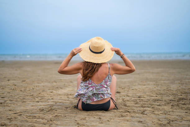 istock Woman On Beach In Summer 1651169147