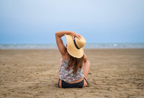 istock Woman On Beach In Summer 1651170211