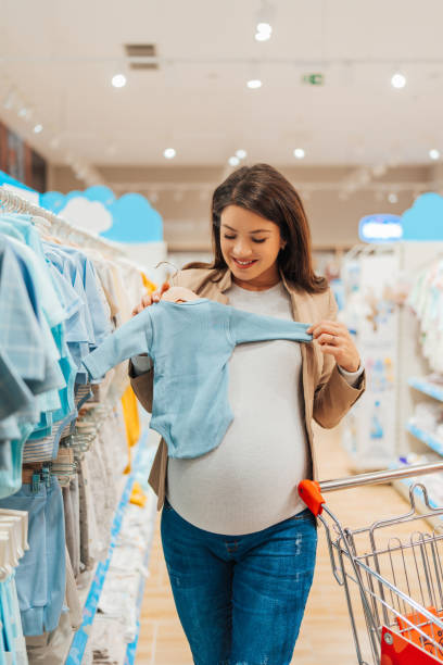 istock Beautiful young mother in baby shop 1651177314